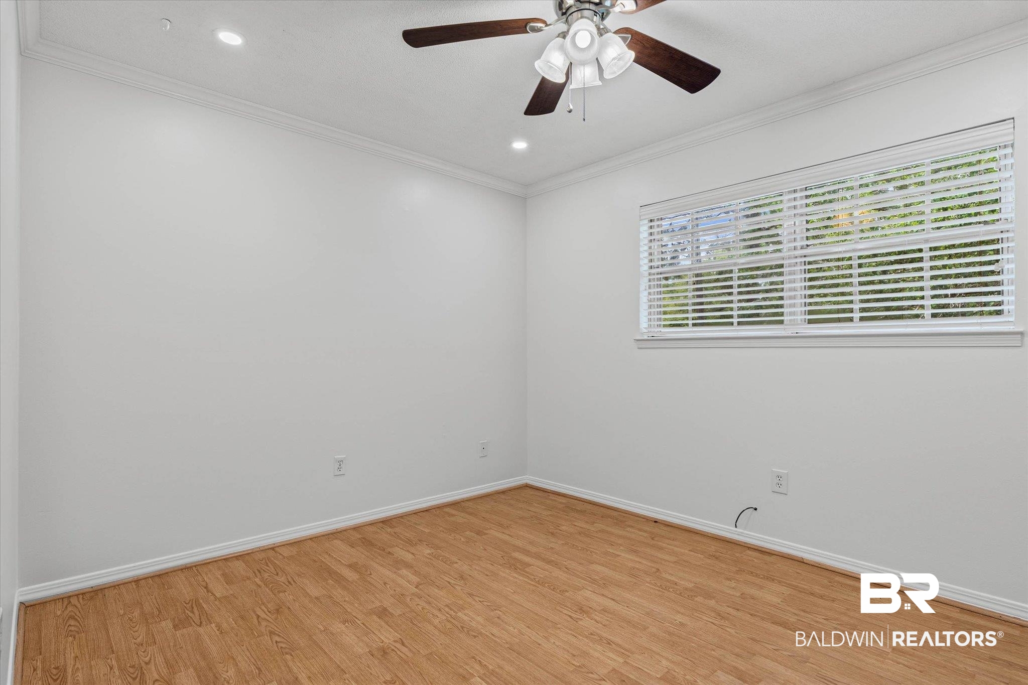 8301 Fordham Road Mobile, AL 36619 - Photo 21 of 57 Spacious room featuring wood-finish flooring, a window with horizontal blinds, recessed lighting, and a ceiling fan with integrated light fixture