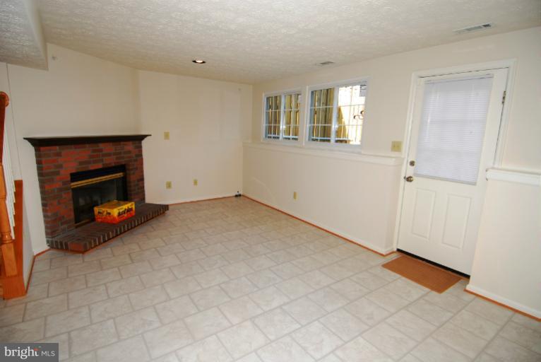 7559 Aspenpark Road Lorton, VA 22079 - Photo 13 of 14 Family Room with Fireplace