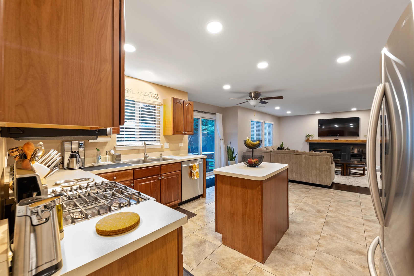 327 Berkeley Drive Bolingbrook, IL 60440 - Photo 14 of 50 a kitchen with a sink stove and refrigerator