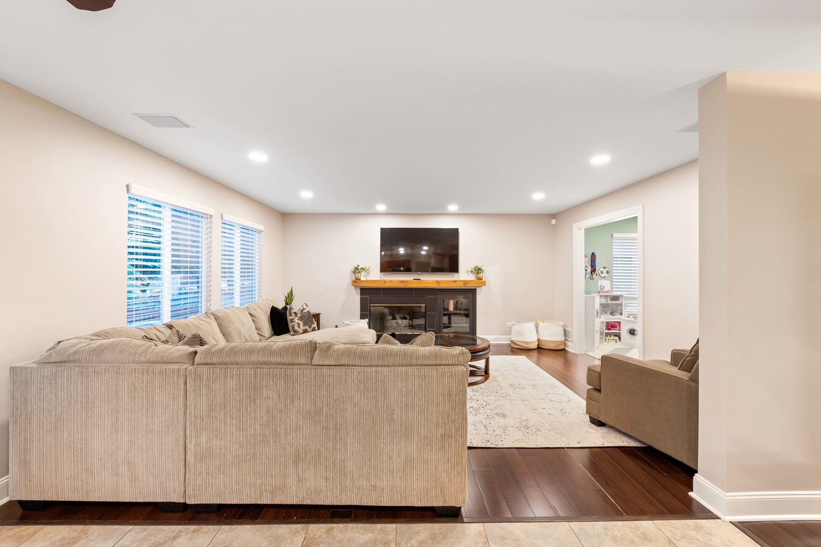327 Berkeley Drive Bolingbrook, IL 60440 - Photo 19 of 50 a living room with furniture and a flat screen tv