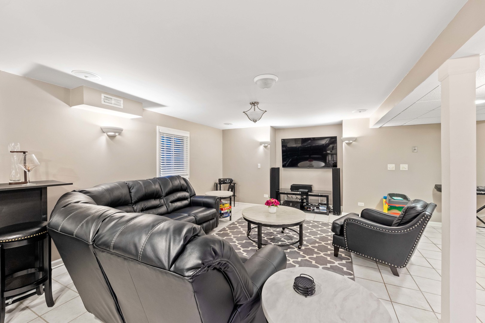 327 Berkeley Drive Bolingbrook, IL 60440 - Photo 30 of 50 a living room with furniture and a large window