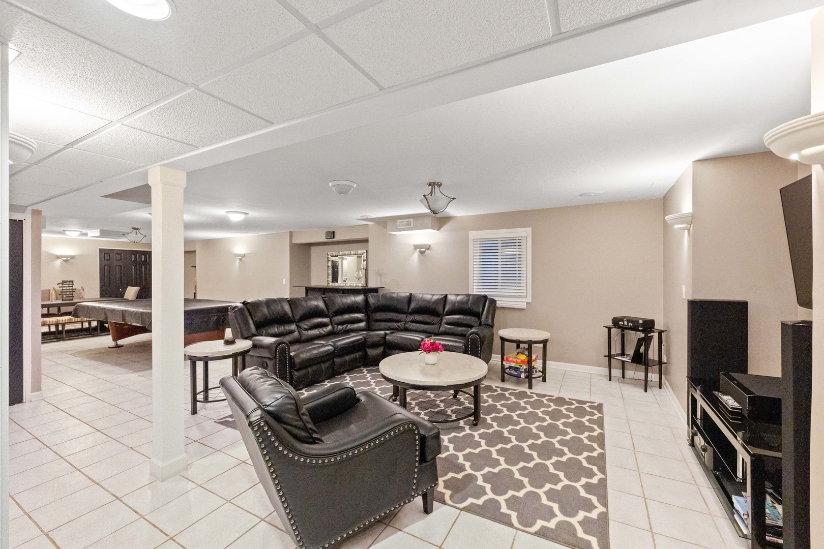 327 Berkeley Drive Bolingbrook, IL 60440 - Photo 32 of 50 a living room with furniture and a flat screen tv