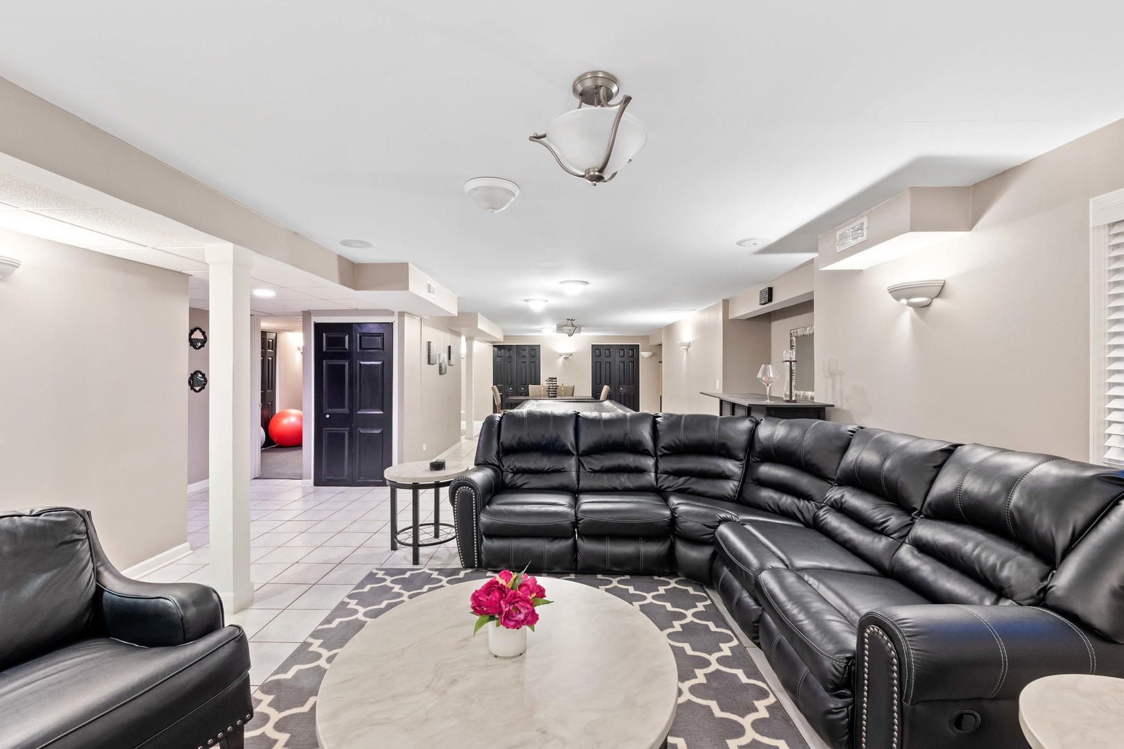 327 Berkeley Drive Bolingbrook, IL 60440 - Photo 33 of 50 a living room with furniture and a chandelier