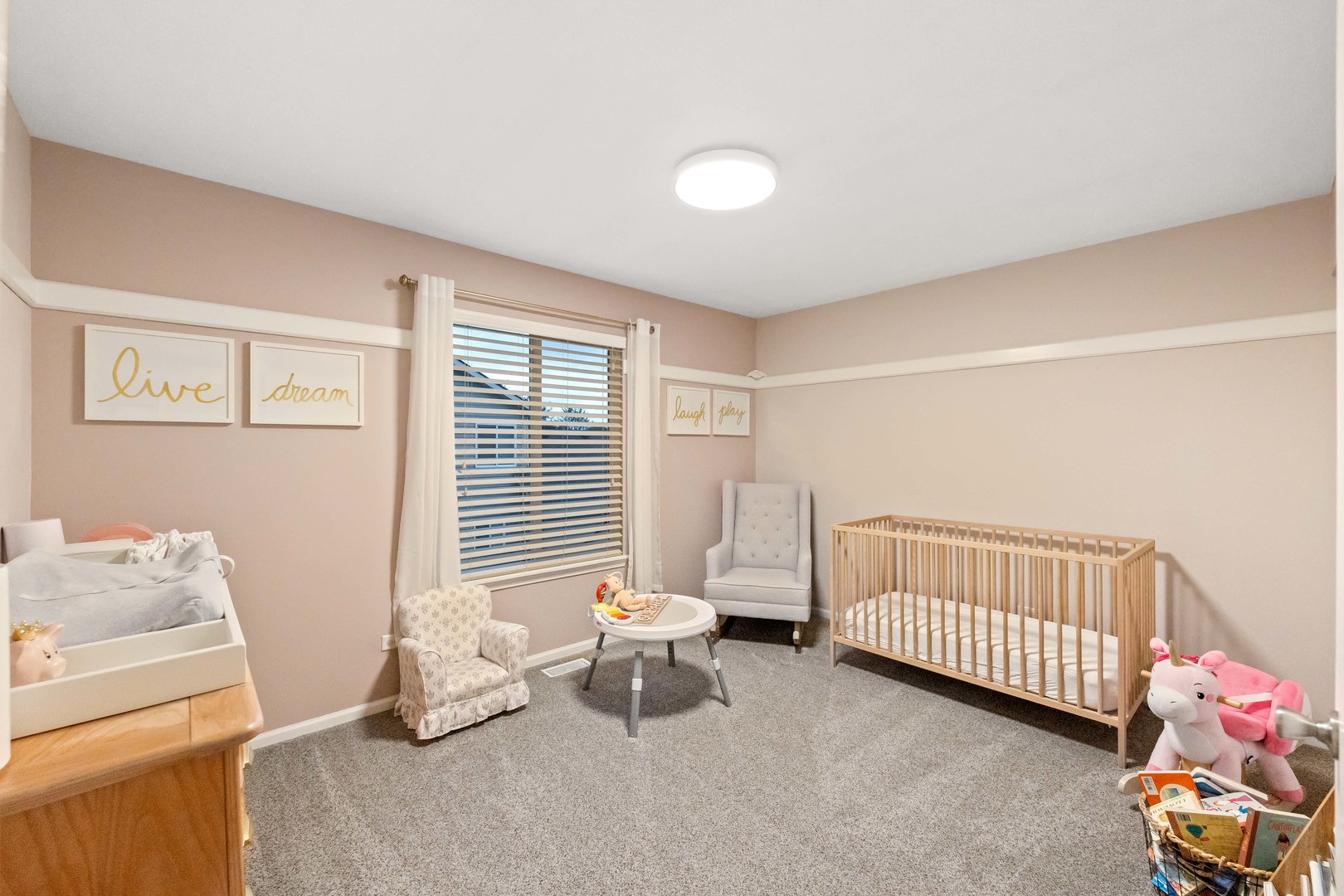 327 Berkeley Drive Bolingbrook, IL 60440 - Photo 39 of 50 a bedroom with a baby bed a couch and a window
