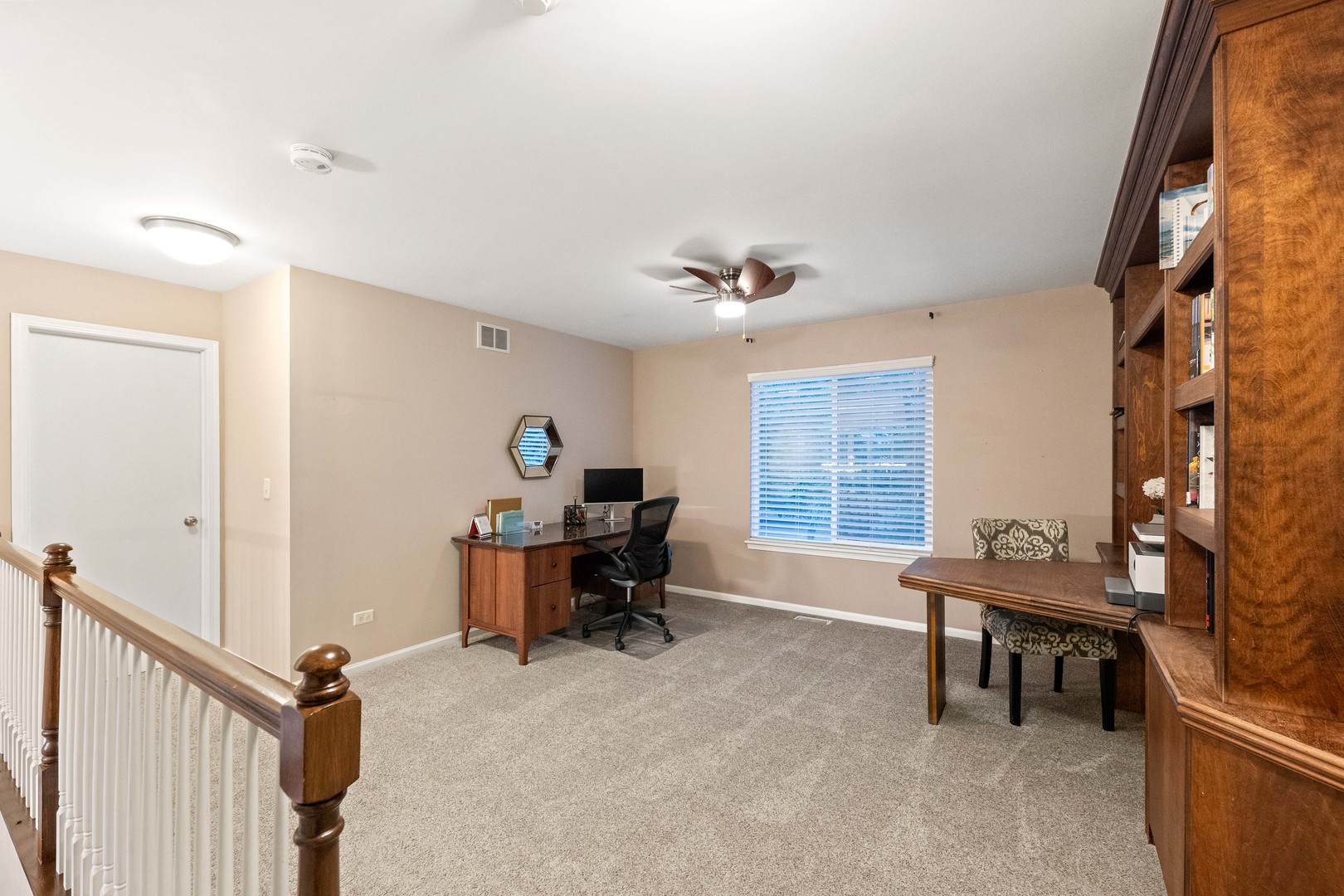 327 Berkeley Drive Bolingbrook, IL 60440 - Photo 42 of 50 a view of a workspace with furniture and a window