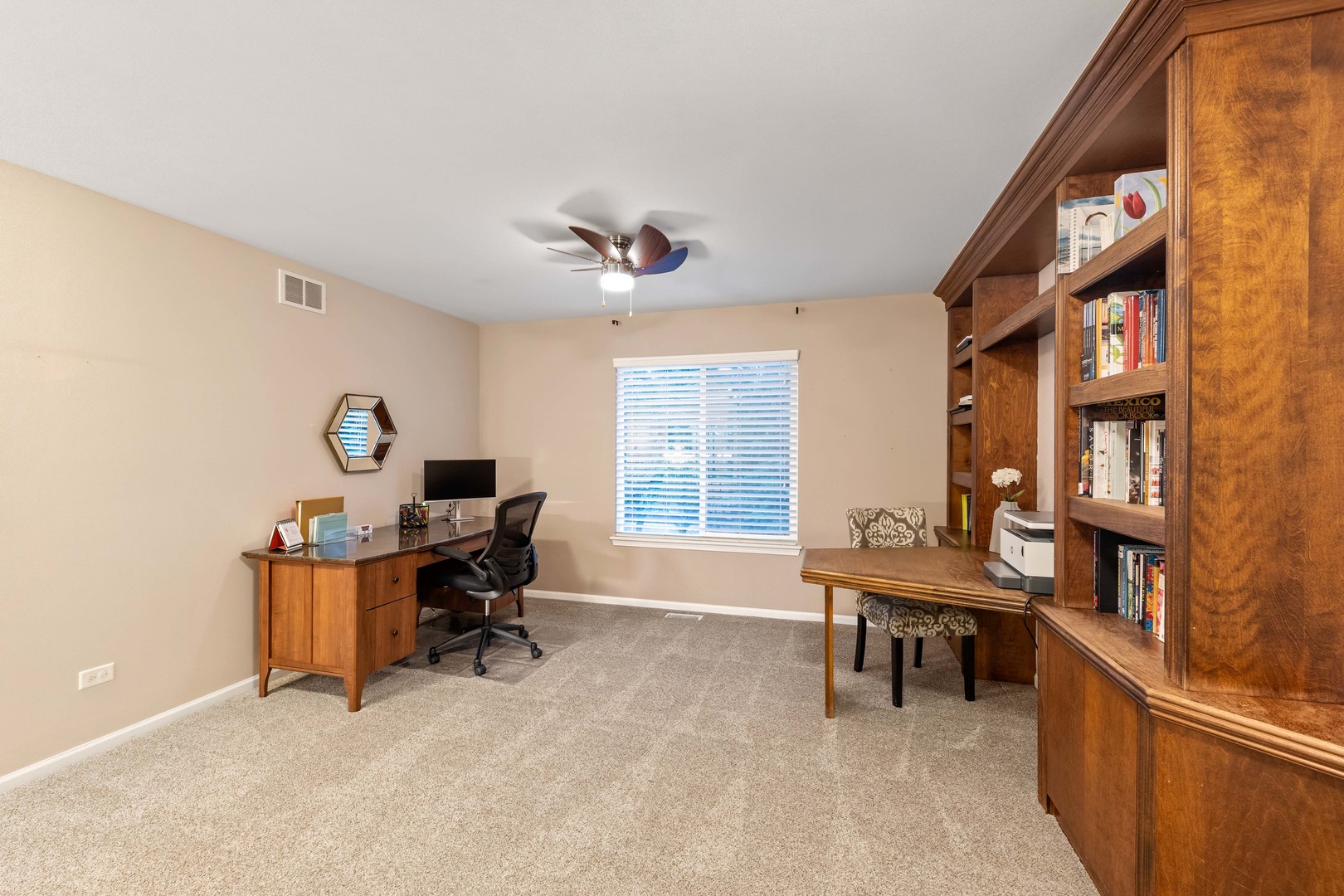 327 Berkeley Drive Bolingbrook, IL 60440 - Photo 43 of 50 a view of a workspace with furniture and a window