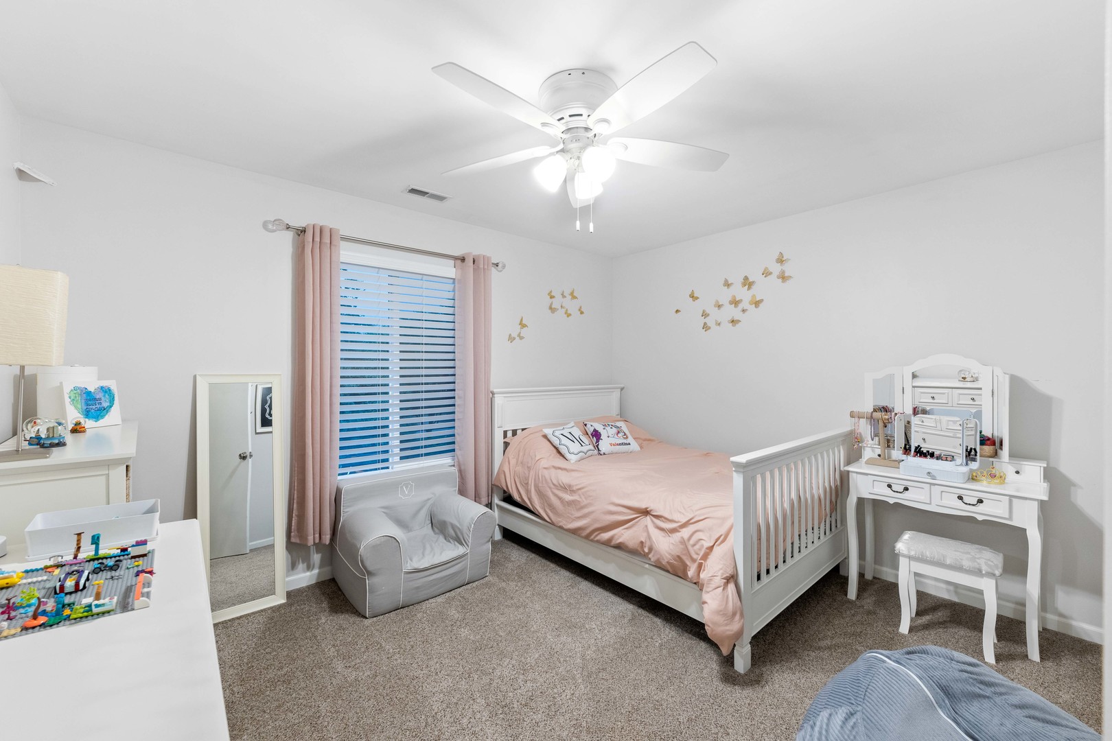 327 Berkeley Drive Bolingbrook, IL 60440 - Photo 45 of 50 a bedroom with a bed and a chandelier