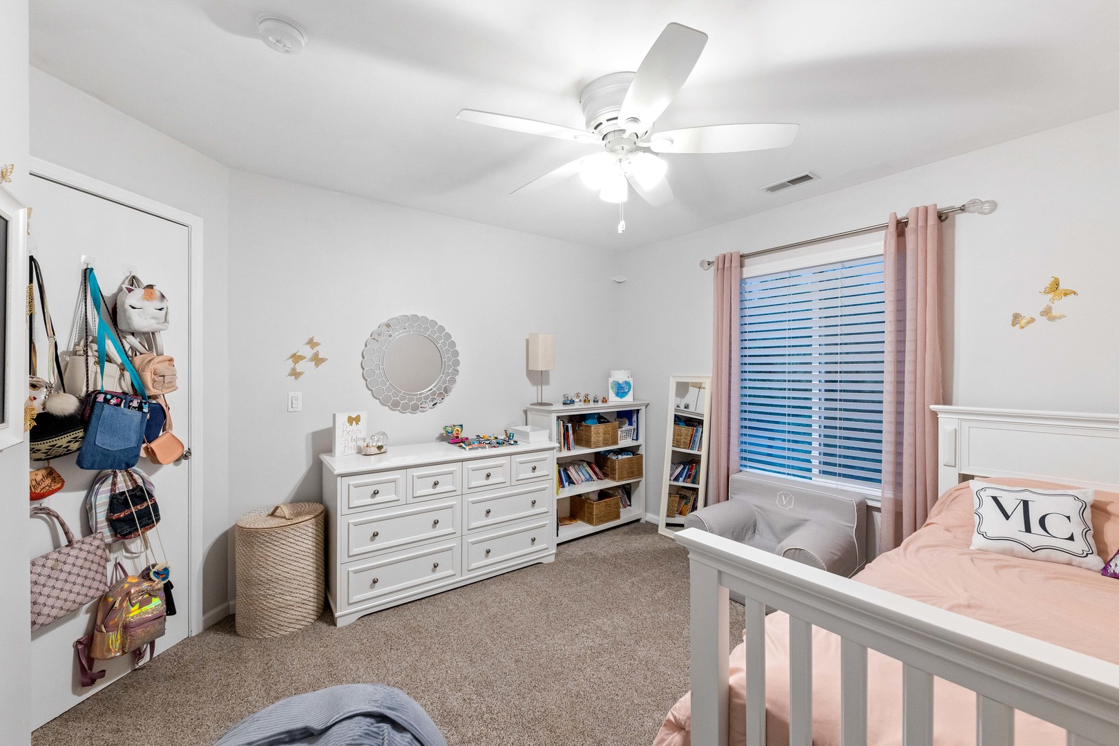 327 Berkeley Drive Bolingbrook, IL 60440 - Photo 47 of 50 a bedroom with a baby bed and a window