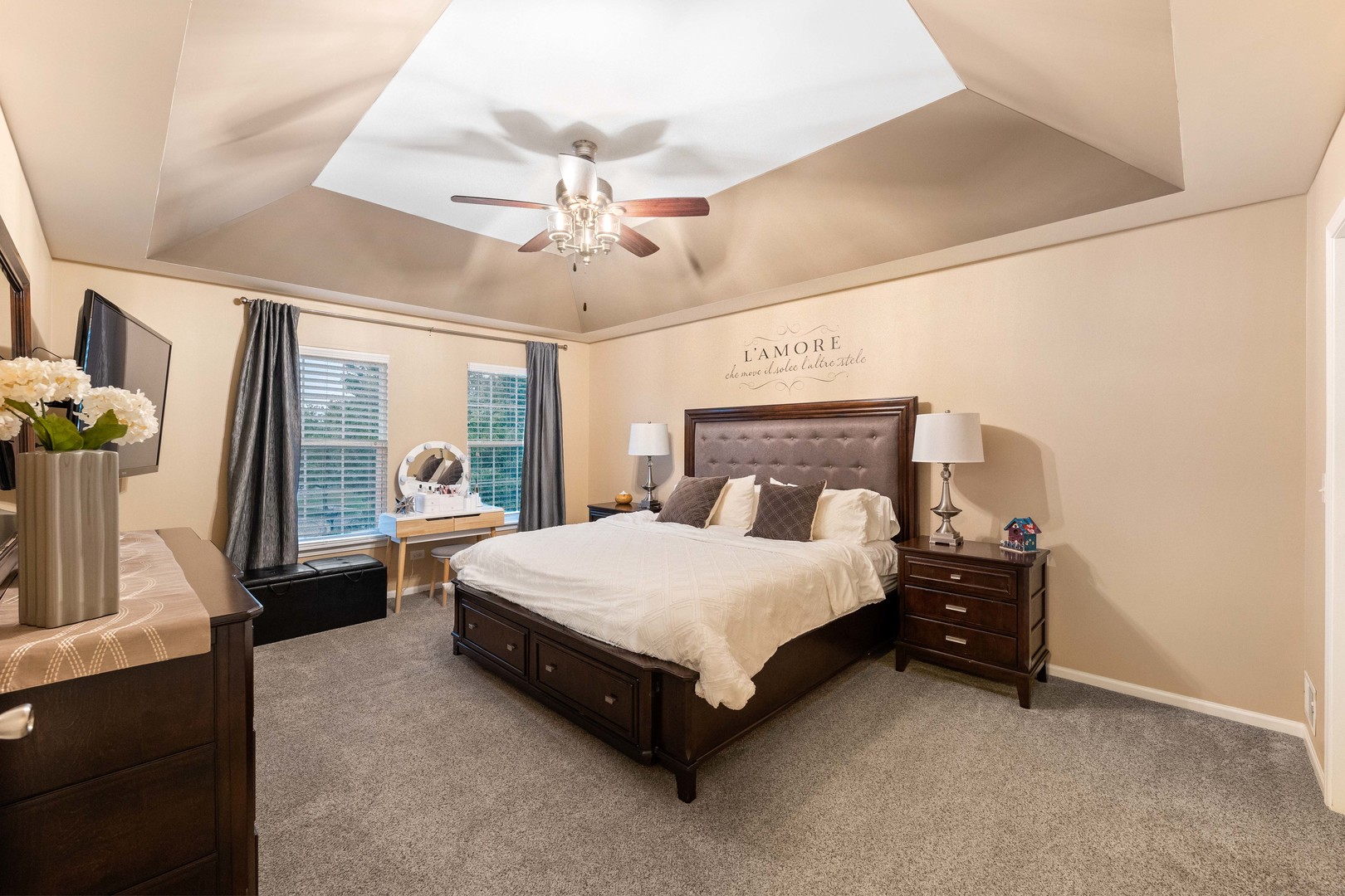 327 Berkeley Drive Bolingbrook, IL 60440 - Photo 48 of 50 a spacious bedroom with a bed and a chandelier