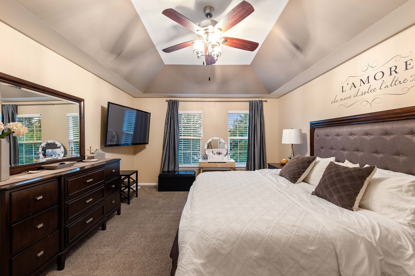 327 Berkeley Drive Bolingbrook, IL 60440 - Photo 49 of 50 a bedroom with a large bed and a flat tv screen on dresser