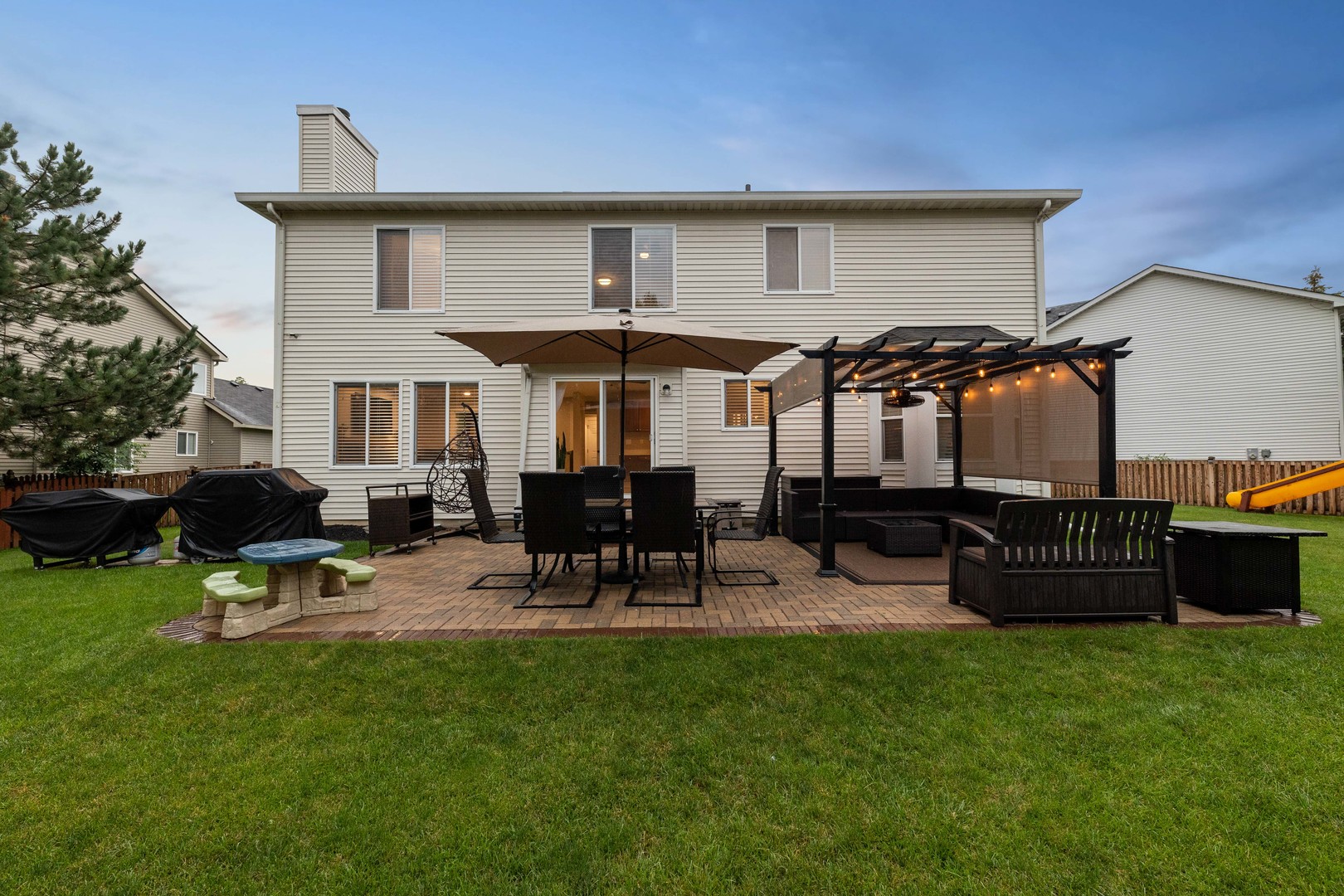 327 Berkeley Drive Bolingbrook, IL 60440 - Photo 6 of 50 a view of a chairs and table in backyard of the house