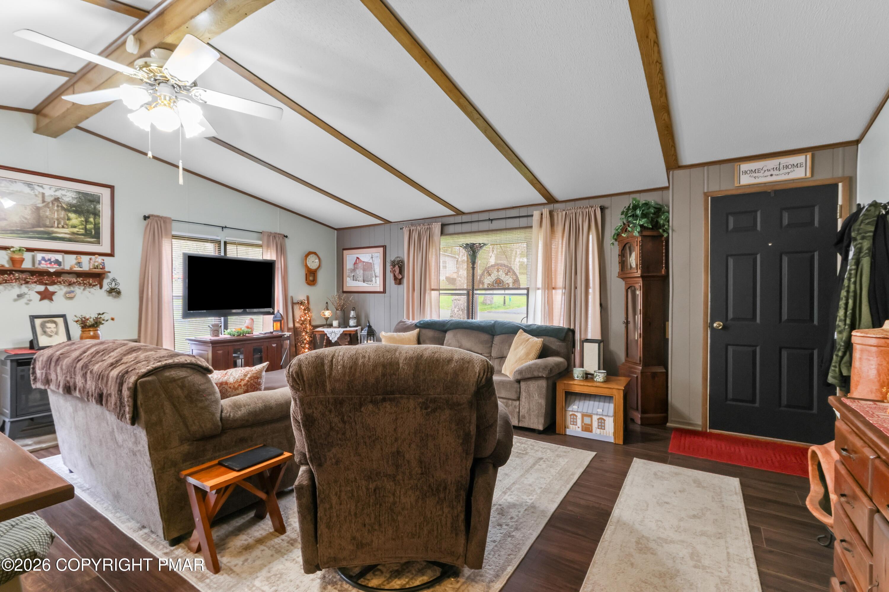 17 Valley View Drive Bath, PA 18014 - Photo 7 of 34 a living room with furniture a flat screen tv and a floor to ceiling window
