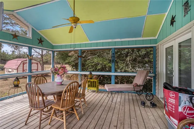 a view of a chairs and table in the balcony