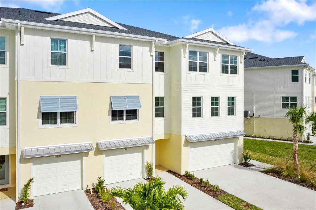 9975 Key Haven Road Seminole, FL 33777 - Photo 2 of 56 a front view of a house with a garden