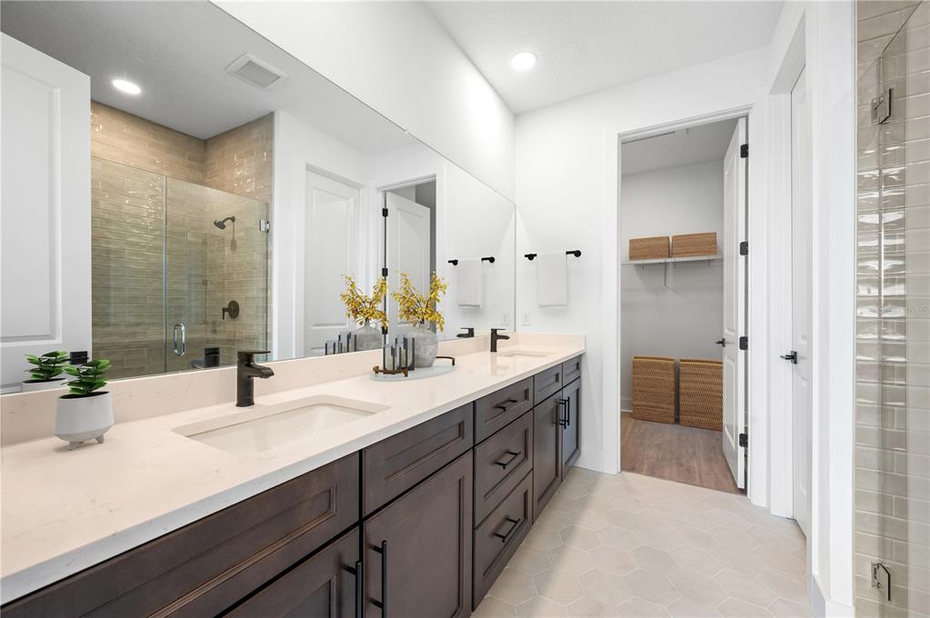 9975 Key Haven Road Seminole, FL 33777 - Photo 26 of 56 a bathroom with a double vanity sink mirror and double