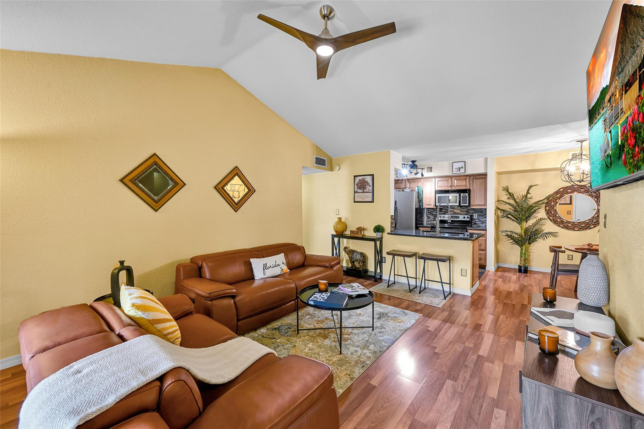875 Riverside Drive, Unit 732 Coral Springs, FL 33071 - Photo 1 of 16 a living room with furniture and wooden floor