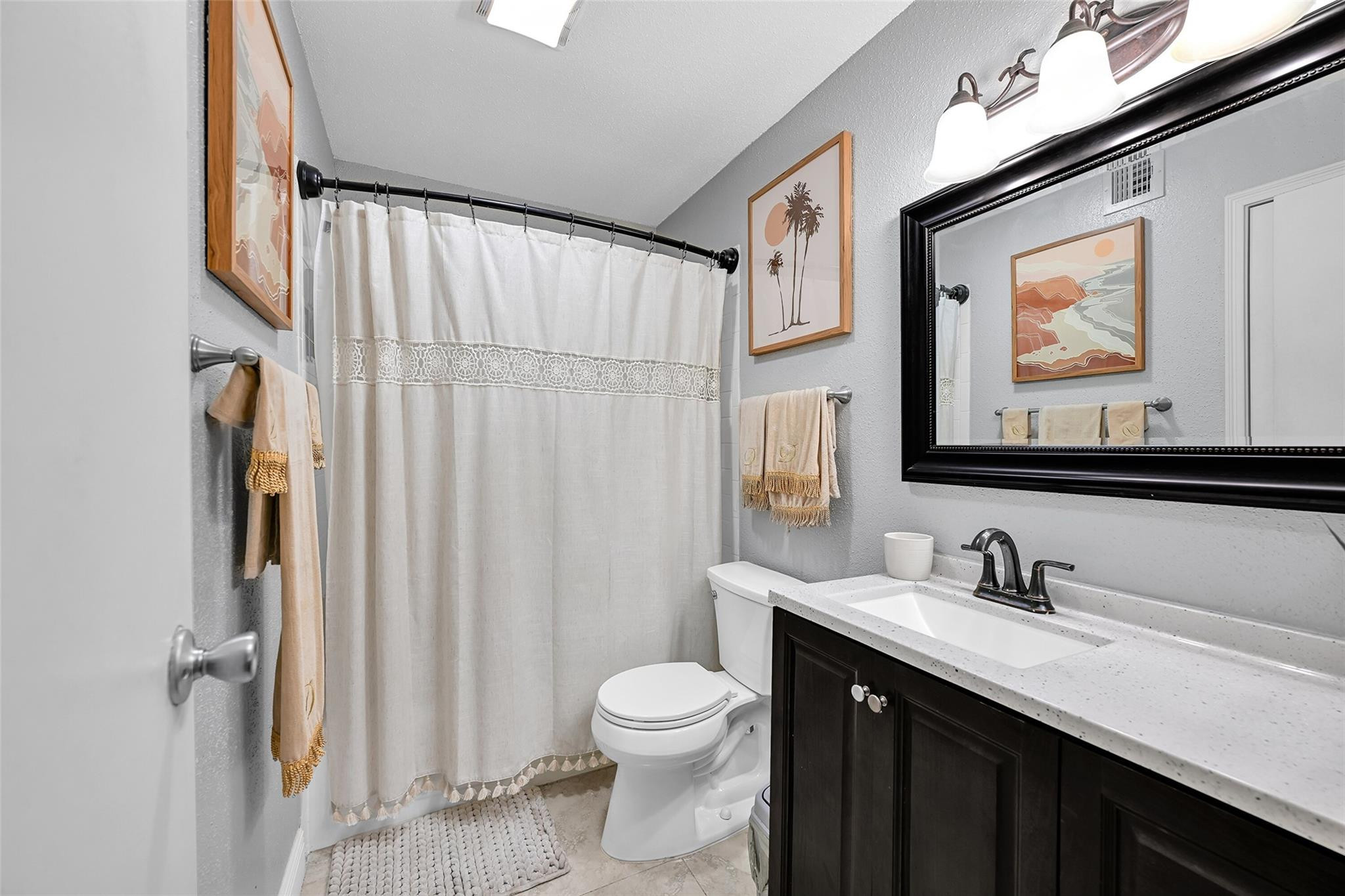 875 Riverside Drive, Unit 732 Coral Springs, FL 33071 - Photo 12 of 16 a bathroom with a toilet a sink and a mirror