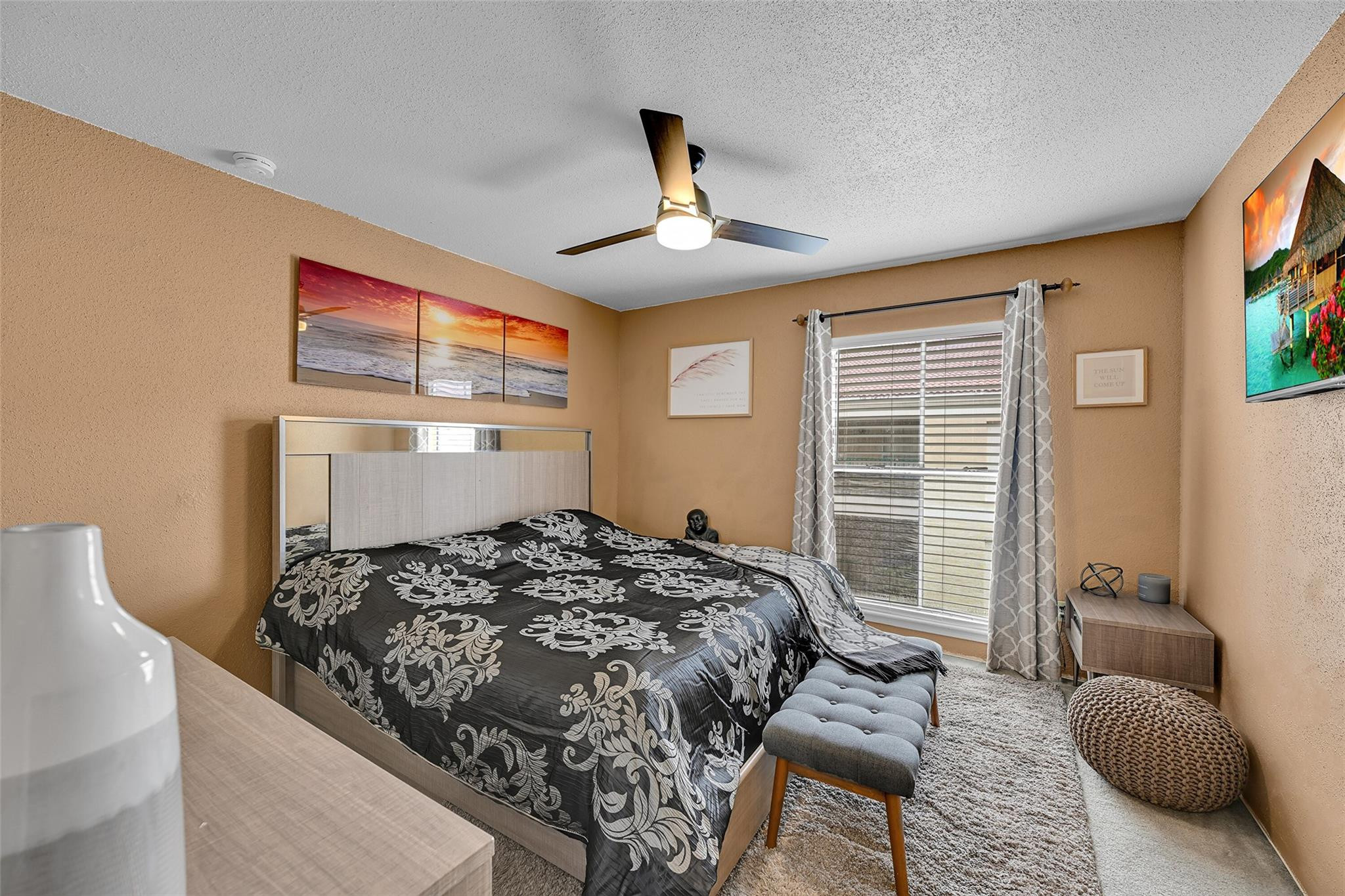 875 Riverside Drive, Unit 732 Coral Springs, FL 33071 - Photo 14 of 16 a bedroom with a bed couch and a window