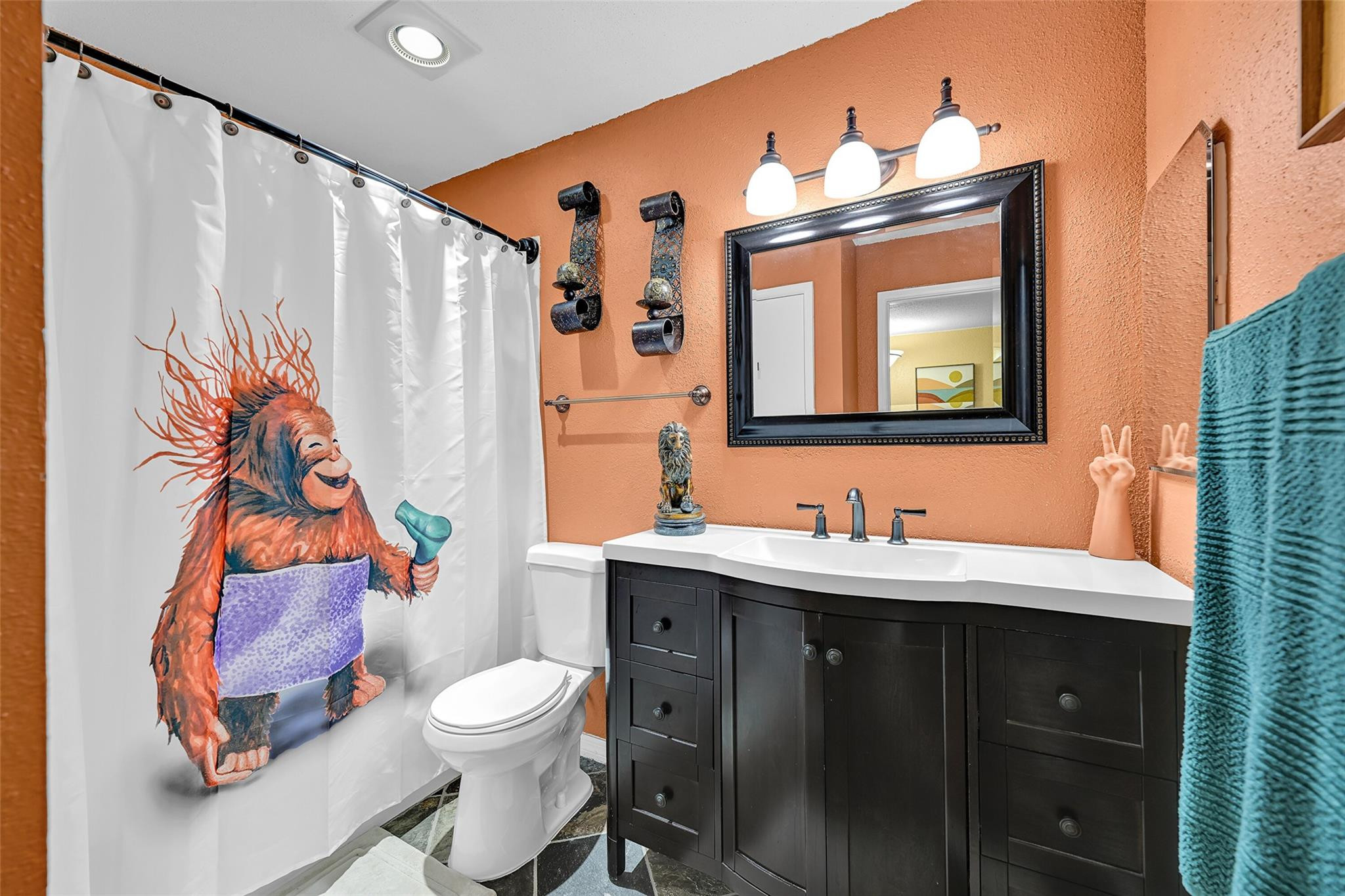 875 Riverside Drive, Unit 732 Coral Springs, FL 33071 - Photo 15 of 16 a bathroom with a toilet sink and mirror