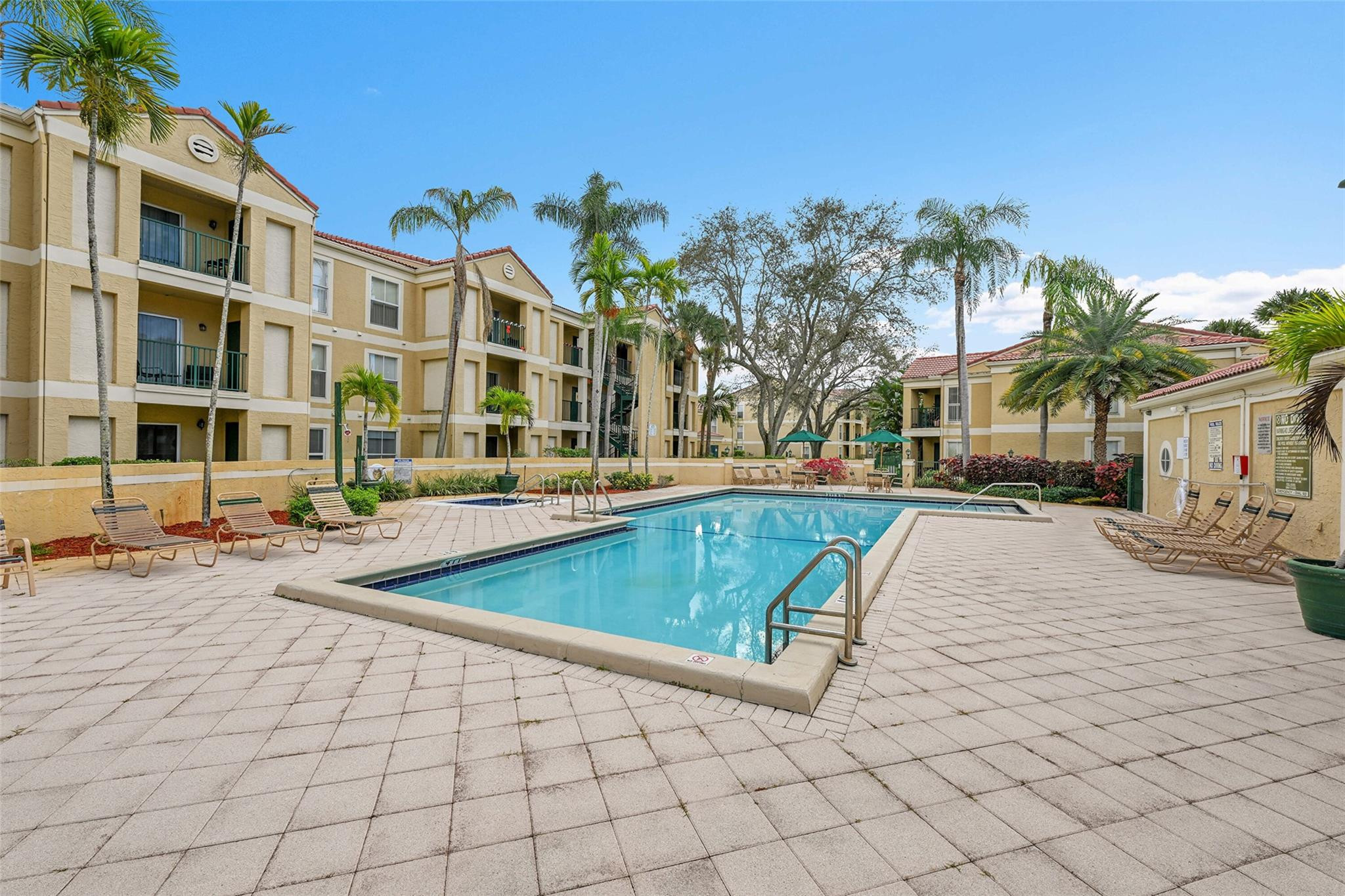 875 Riverside Drive, Unit 732 Coral Springs, FL 33071 - Photo 16 of 16 a view of a building with a swimming pool