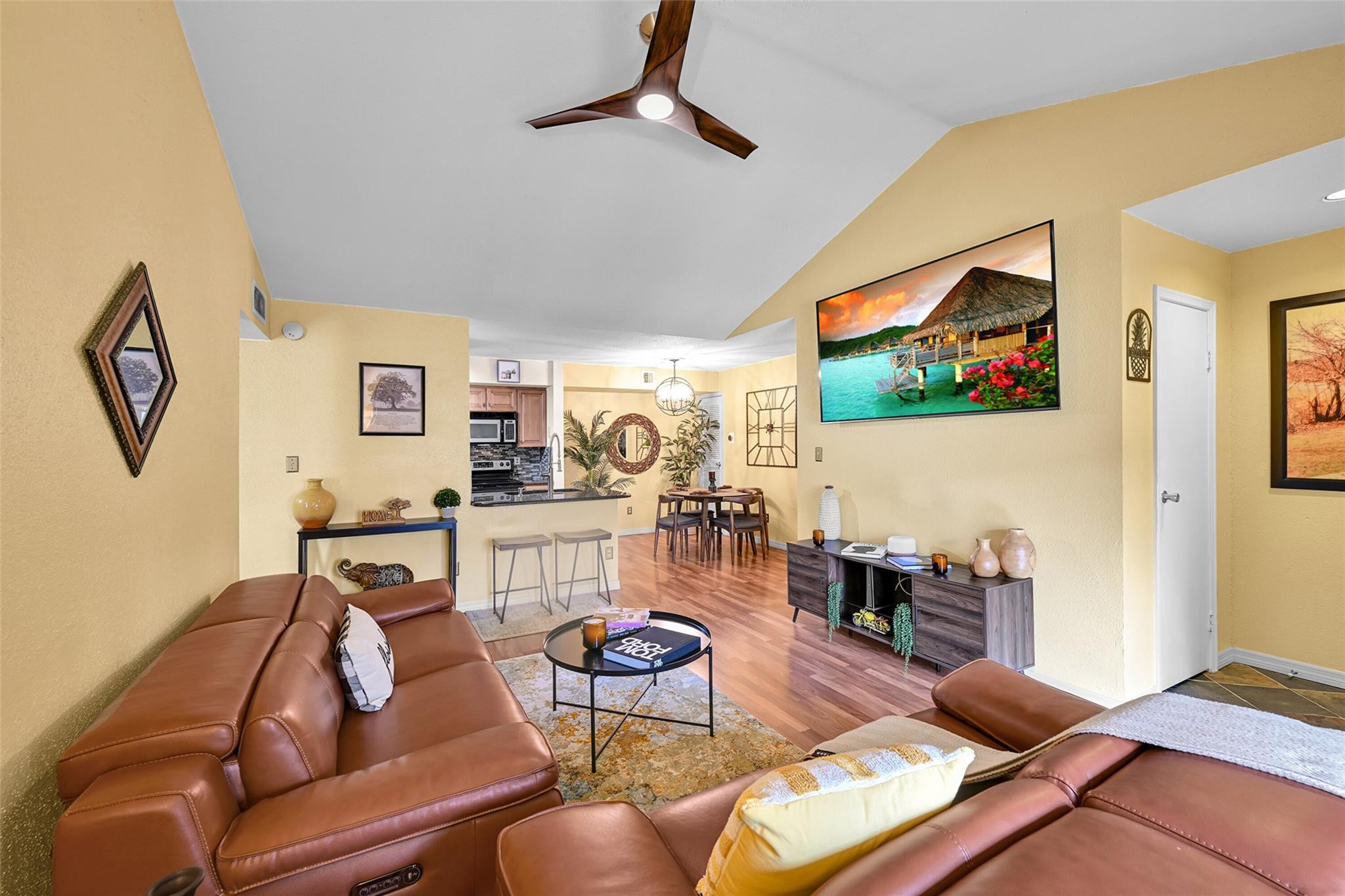 875 Riverside Drive, Unit 732 Coral Springs, FL 33071 - Photo 4 of 16 a living room with furniture and a flat screen tv