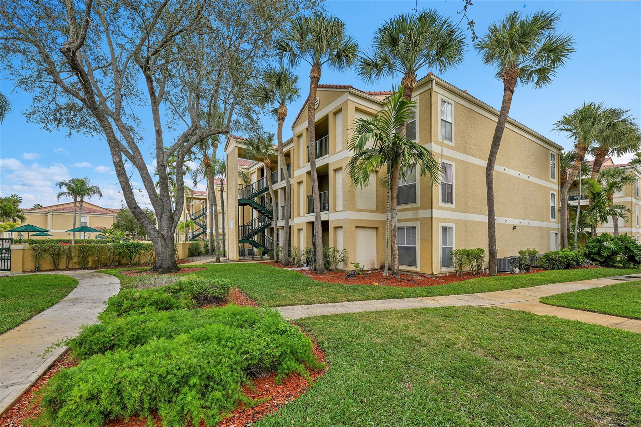 875 Riverside Drive, Unit 732 Coral Springs, FL 33071 - Photo 6 of 16 front view of a house with a yard