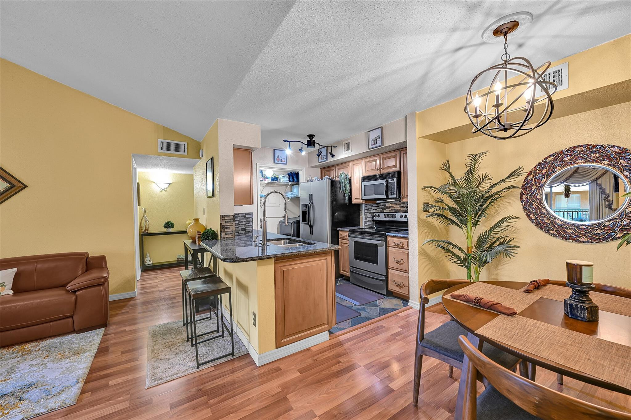 875 Riverside Drive, Unit 732 Coral Springs, FL 33071 - Photo 7 of 16 a living room with fireplace furniture and a wooden floor