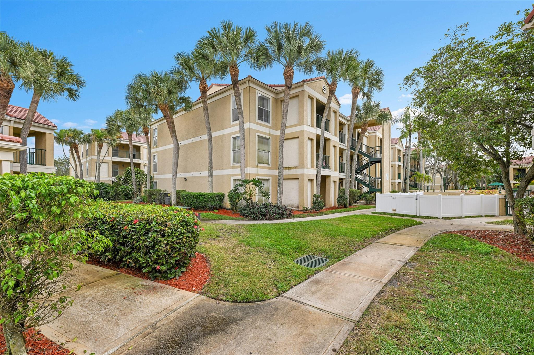 875 Riverside Drive, Unit 732 Coral Springs, FL 33071 - Photo 8 of 16 front view of a house with a yard
