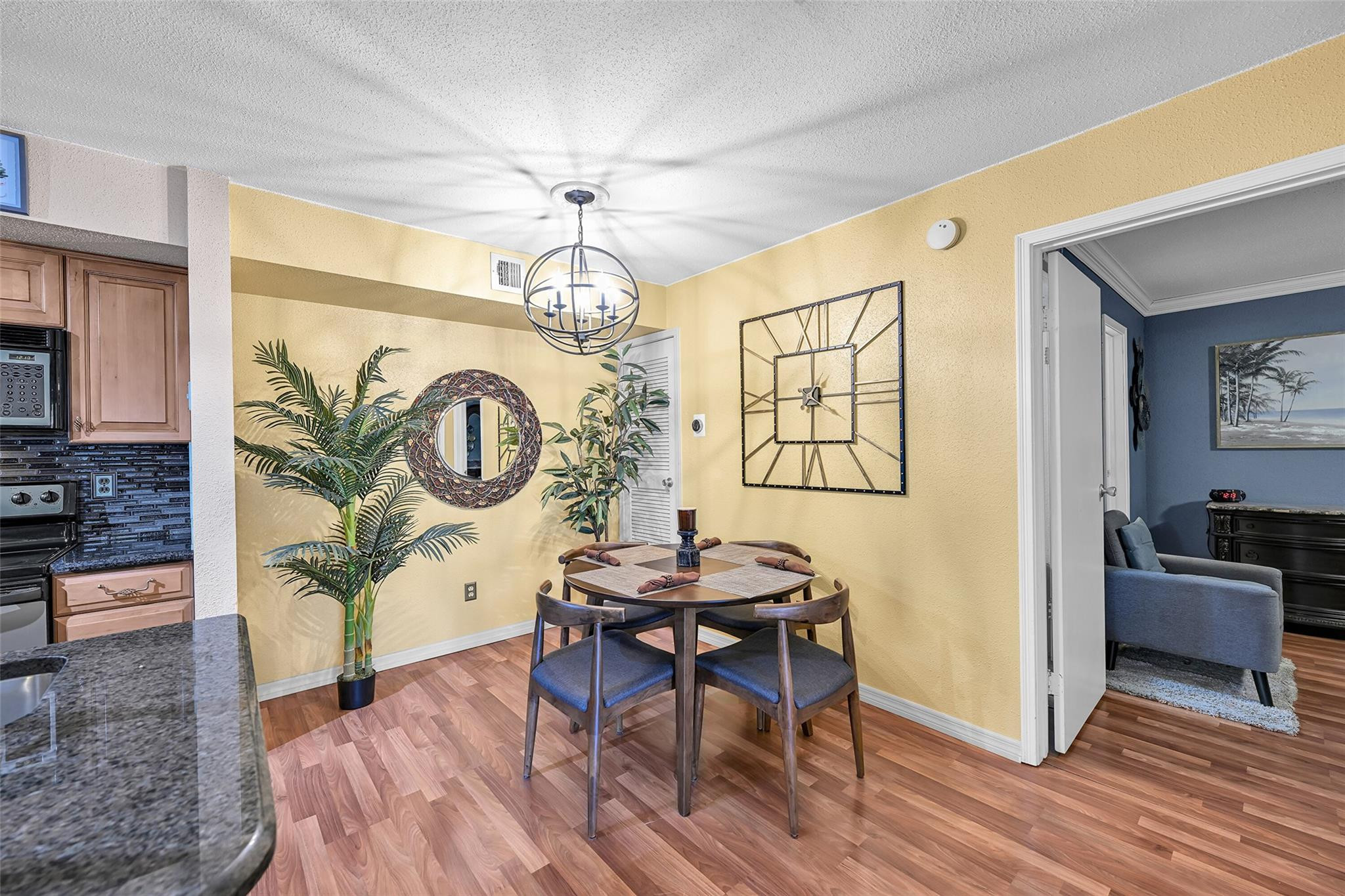 875 Riverside Drive, Unit 732 Coral Springs, FL 33071 - Photo 10 of 16 a living room with furniture and a wooden floor