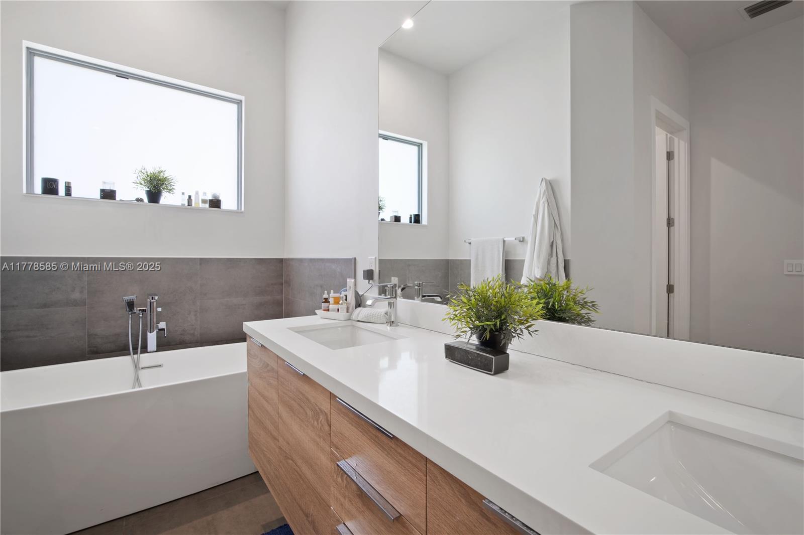 6425 Southwest 27th Street Miami, FL 33155 - Photo 11 of 27 a bathroom with a sink and a mirror