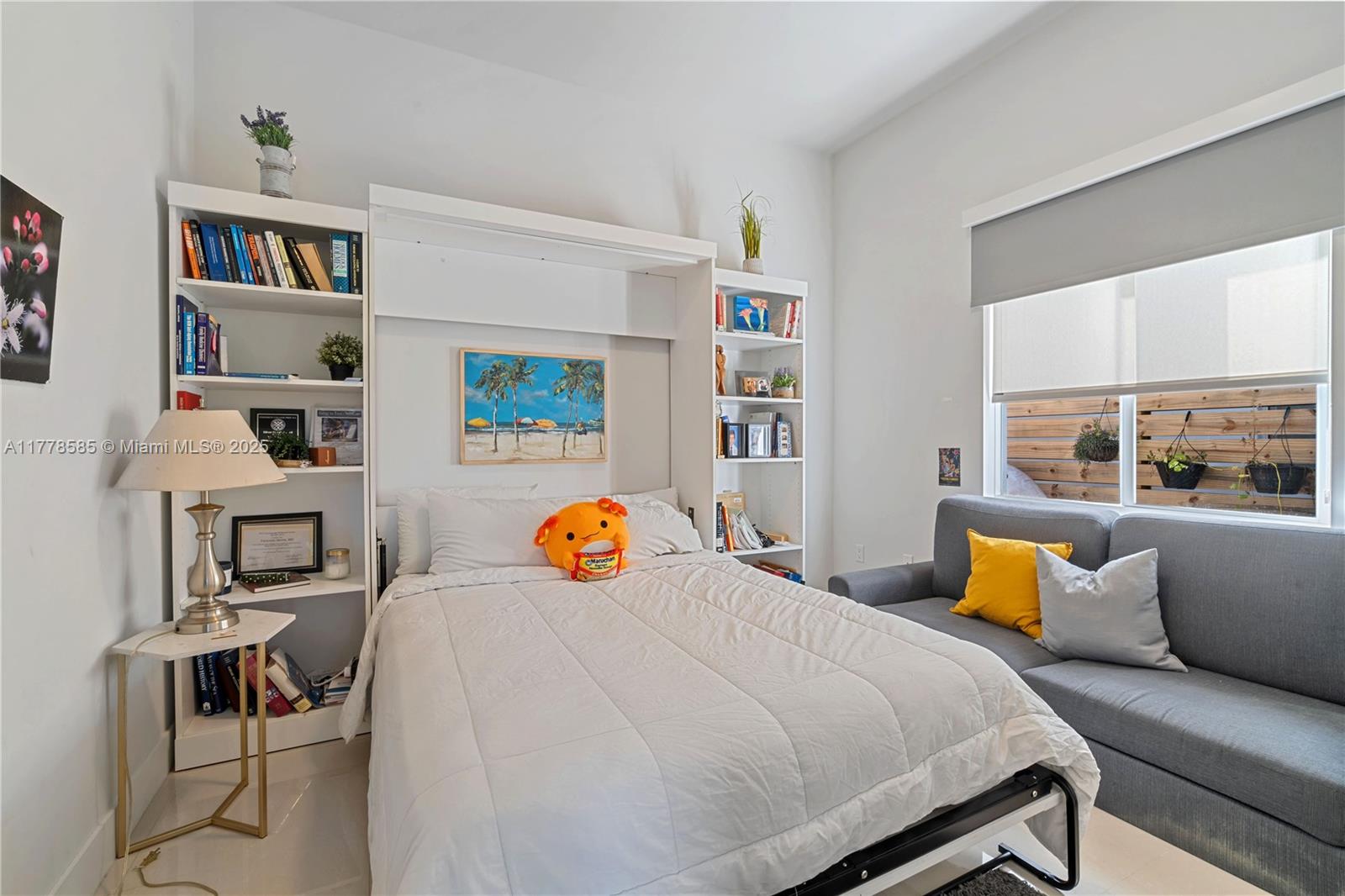 6425 Southwest 27th Street Miami, FL 33155 - Photo 12 of 27 a bedroom with a bed and a workspace