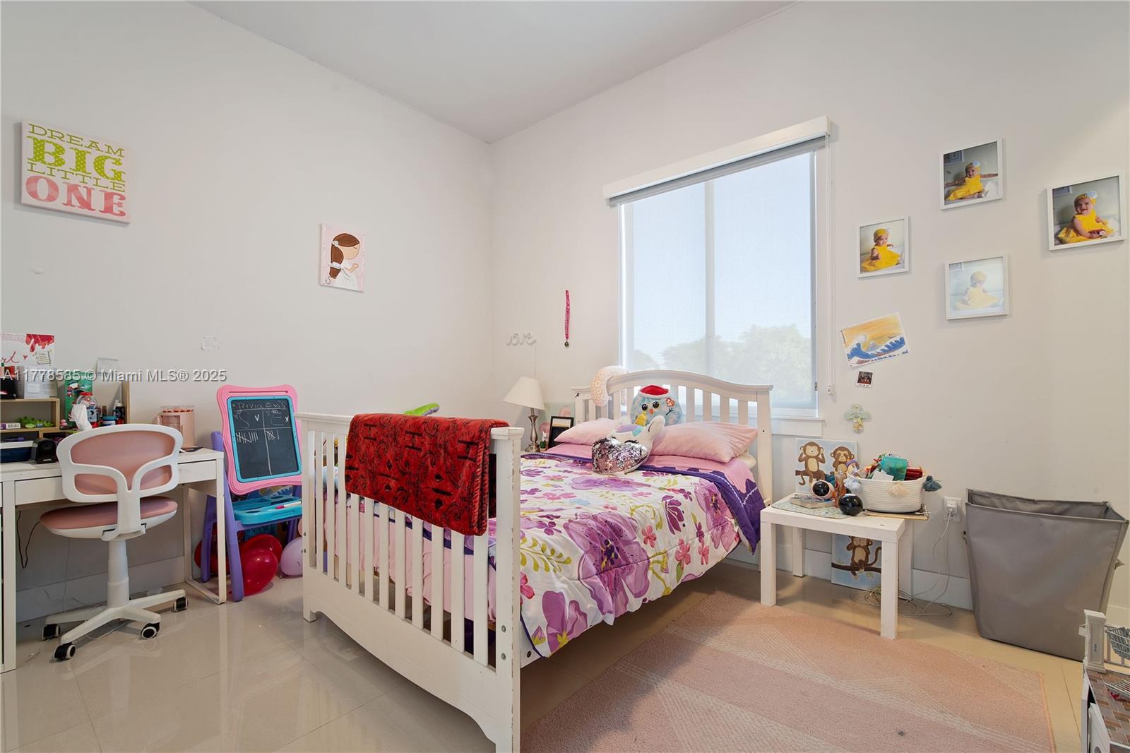 6425 Southwest 27th Street Miami, FL 33155 - Photo 14 of 27 a bedroom with a bed and a table