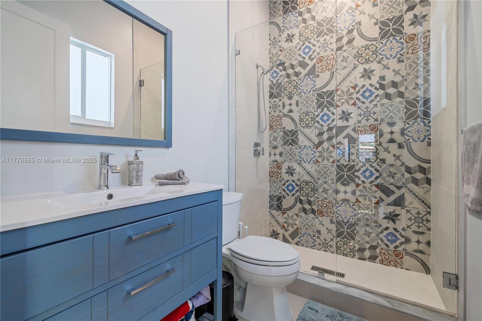6425 Southwest 27th Street Miami, FL 33155 - Photo 15 of 27 a bathroom with a sink a toilet and shower