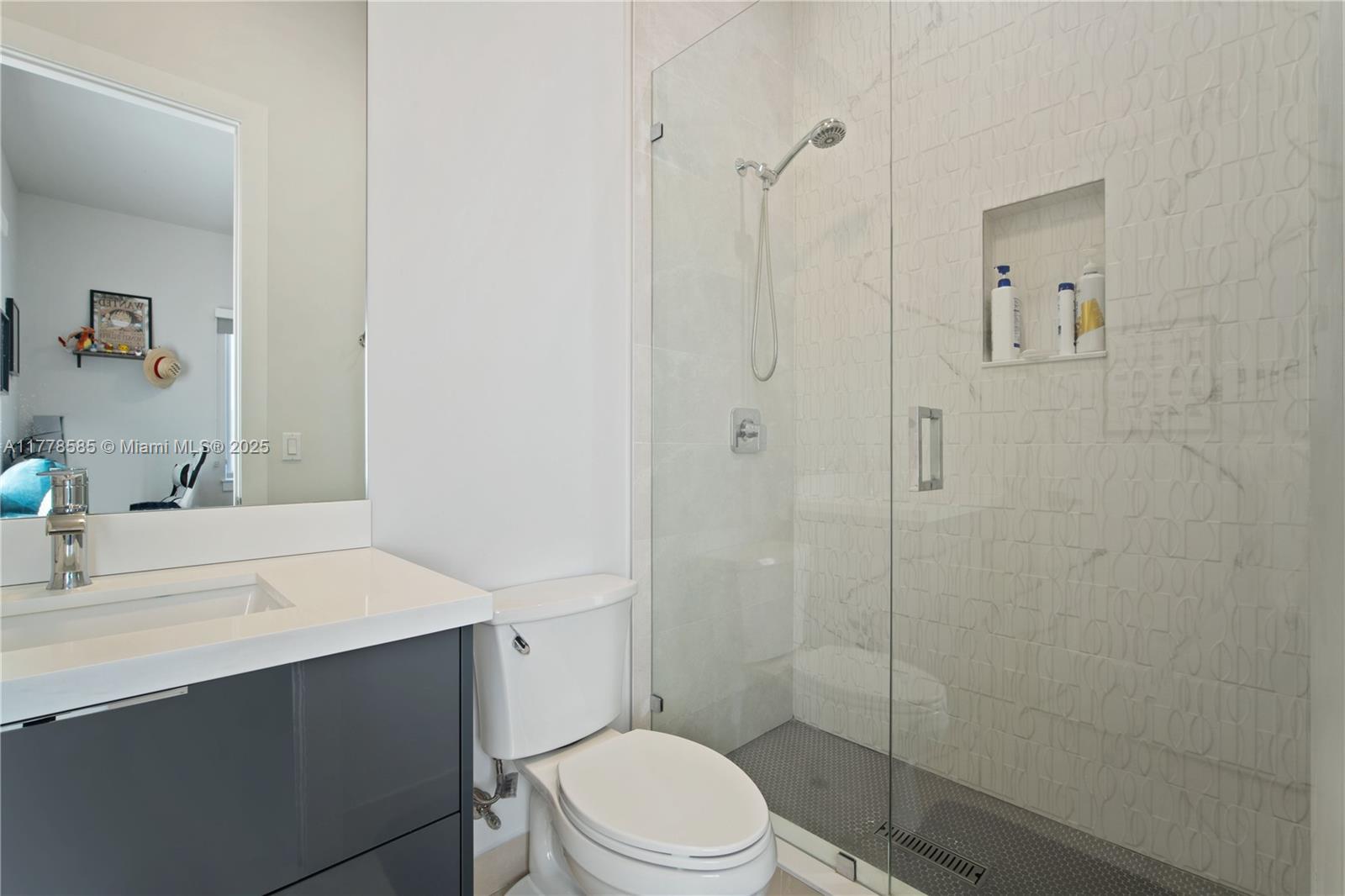 6425 Southwest 27th Street Miami, FL 33155 - Photo 17 of 27 a bathroom with a sink a toilet and shower