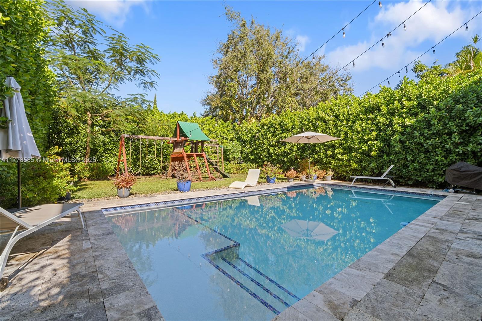 6425 Southwest 27th Street Miami, FL 33155 - Photo 19 of 27 swimming pool with view of trees
