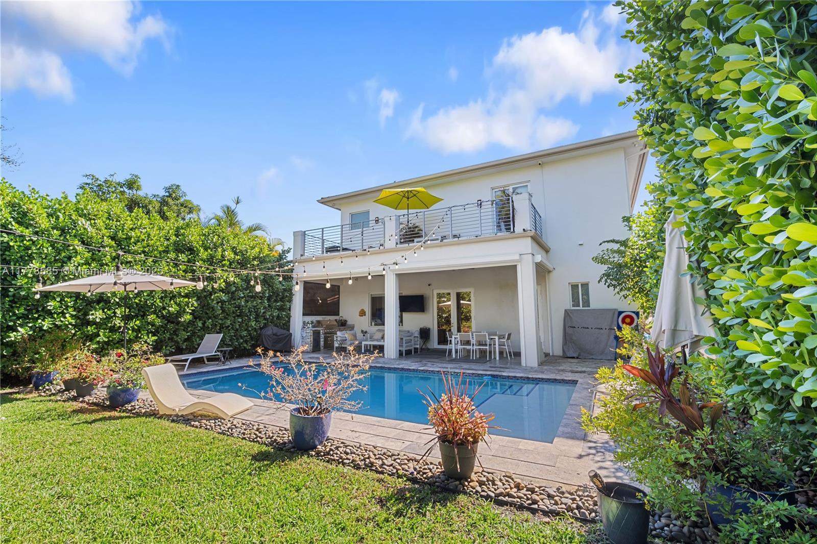 6425 Southwest 27th Street Miami, FL 33155 - Photo 2 of 27 a front view of a house with garden
