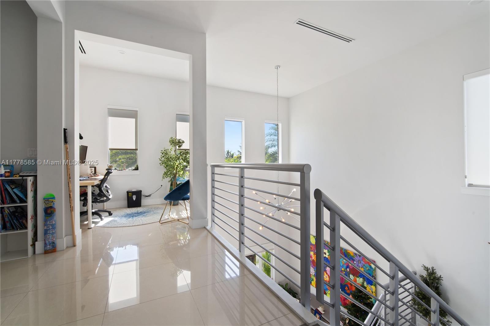 6425 Southwest 27th Street Miami, FL 33155 - Photo 24 of 27 a view of a hallway with wooden floor and furniture