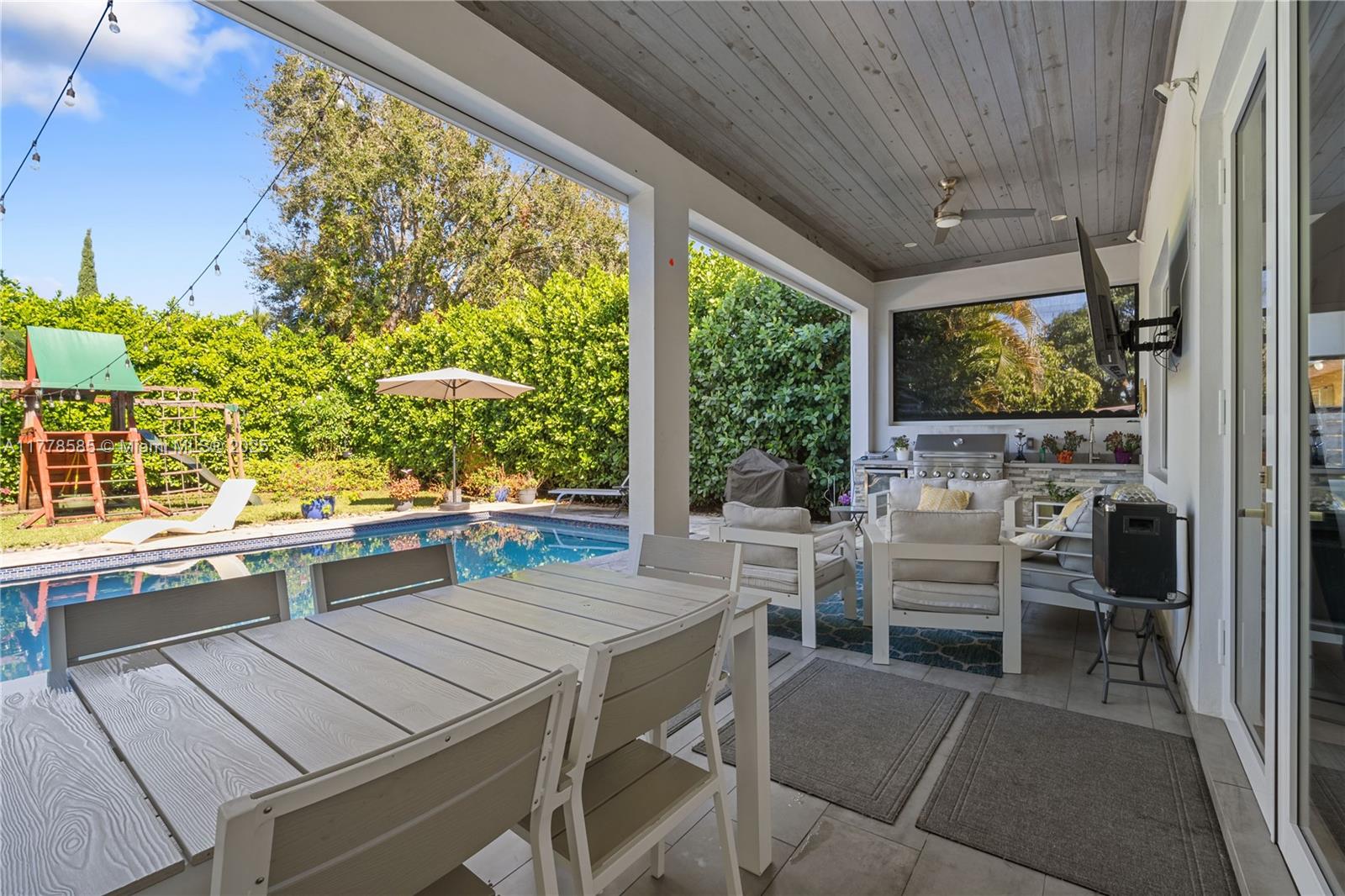 6425 Southwest 27th Street Miami, FL 33155 - Photo 6 of 27 a outdoor dining space with furniture and outdoor view
