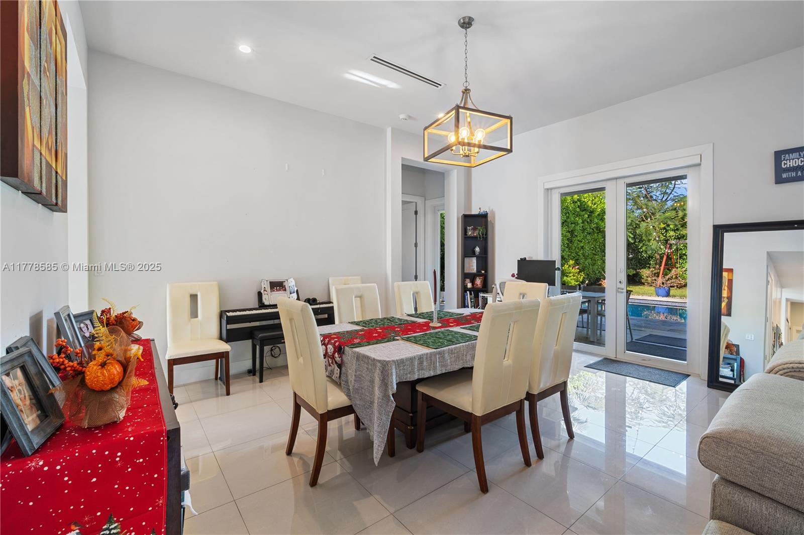6425 Southwest 27th Street Miami, FL 33155 - Photo 8 of 27 a view of a dining room with furniture window and outside view