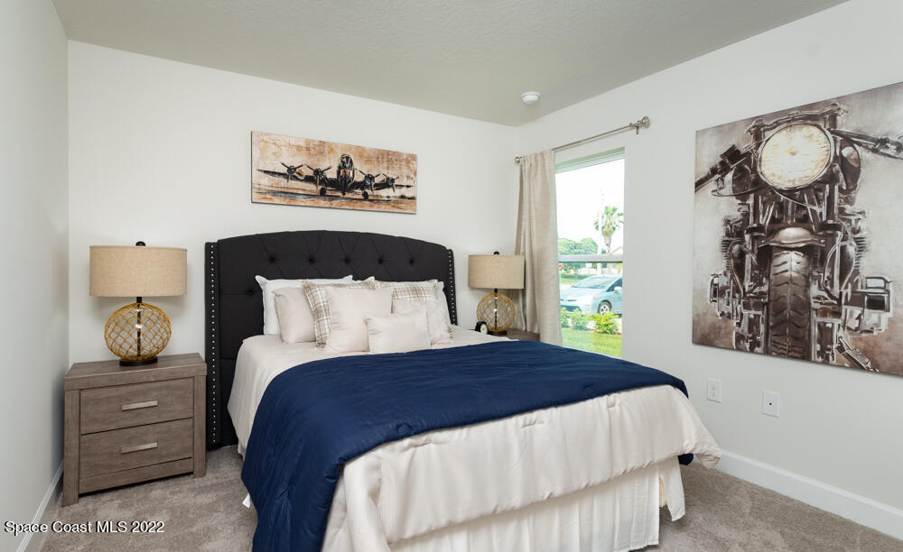 2250 Angel Road Palm Bay, FL 32909 - Photo 10 of 16 a bedroom with a bed and window