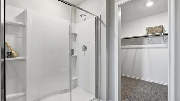 a bathroom with a double vanity sink and mirror