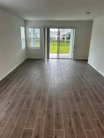 wooden view of an empty room with a window