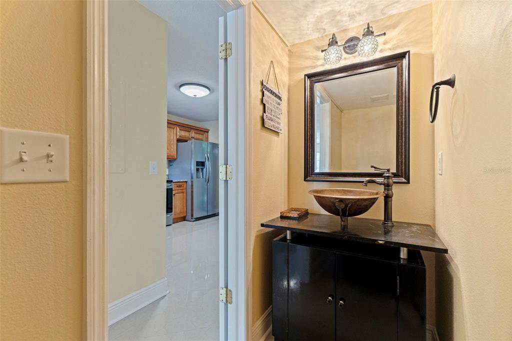 5100 Burchette Road, Unit 2301 Tampa, FL 33647 - Photo 14 of 39 a bathroom with a sink a vanity and a mirror