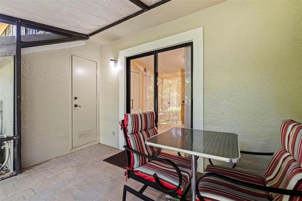 5100 Burchette Road, Unit 2301 Tampa, FL 33647 - Photo 16 of 39 a view of a dining room with furniture and wooden floor