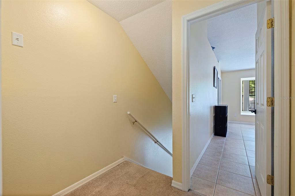 5100 Burchette Road, Unit 2301 Tampa, FL 33647 - Photo 17 of 39 a view of a hallway with wooden shelves
