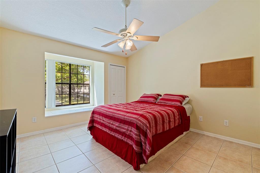 5100 Burchette Road, Unit 2301 Tampa, FL 33647 - Photo 18 of 39 a bedroom with a bed and a window