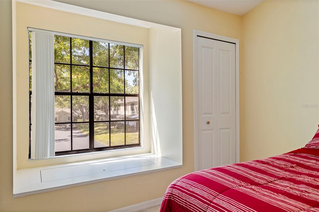 5100 Burchette Road, Unit 2301 Tampa, FL 33647 - Photo 20 of 39 a bedroom with a bed and a large window