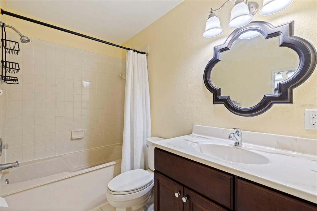 5100 Burchette Road, Unit 2301 Tampa, FL 33647 - Photo 21 of 39 a bathroom with a sink a toilet and a mirror