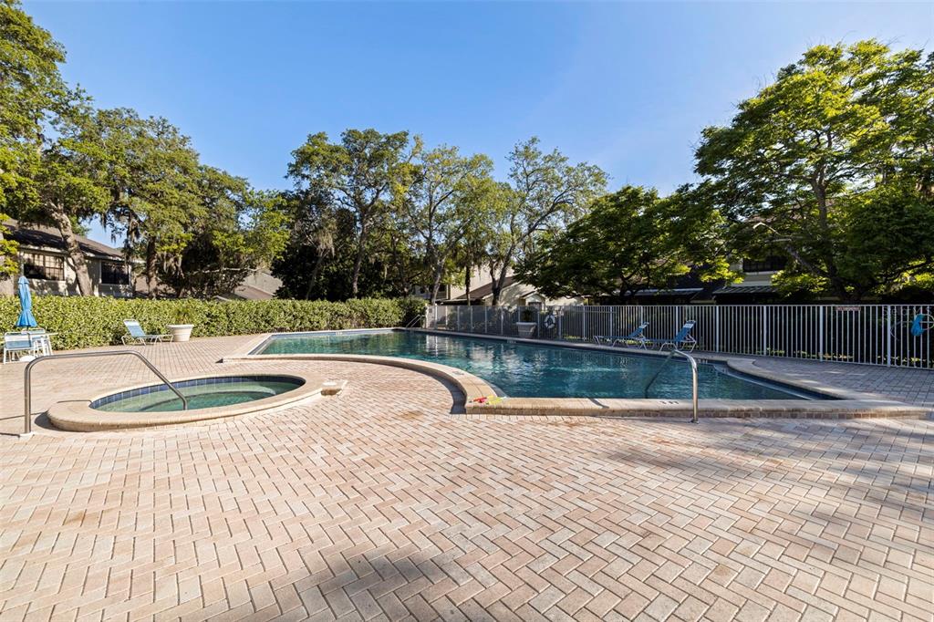 5100 Burchette Road, Unit 2301 Tampa, FL 33647 - Photo 29 of 39 a swimming pool with wooden fence