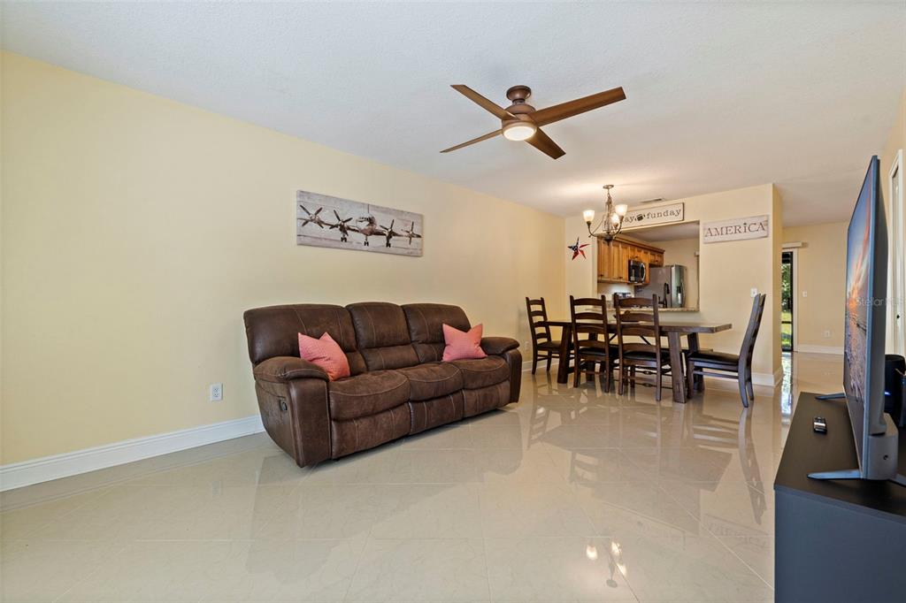 5100 Burchette Road, Unit 2301 Tampa, FL 33647 - Photo 6 of 39 a living room with furniture and a large window